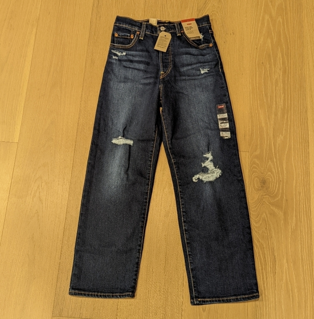 Woman's Distressed Blue Jeans